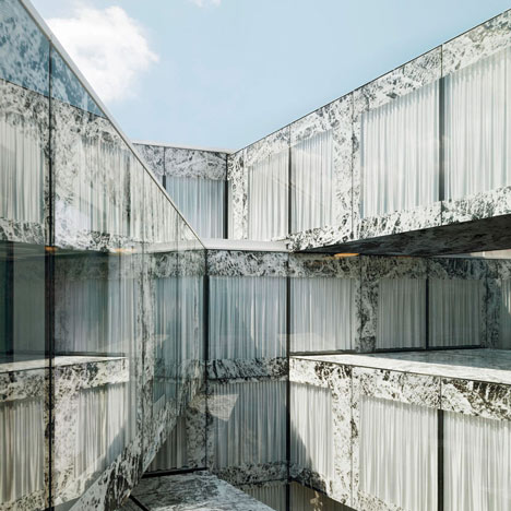 Allianz Headquarters by Wiel Arets features glass fritted to resemble Mies' Barcelona Pavilion