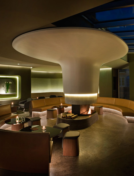 Nature-inspired hotel by Jouin Manku features an organic fireplace