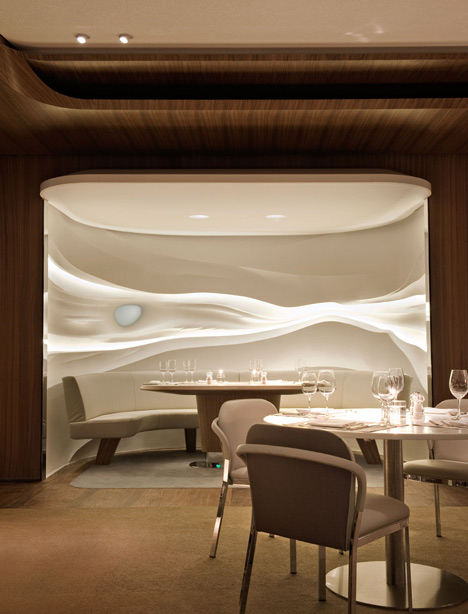 Nature-inspired hotel by Jouin Manku features an organic fireplace