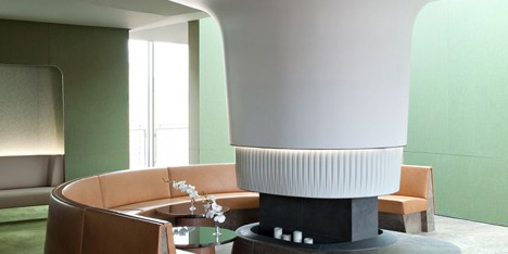 Nature-inspired hotel by Jouin Manku features an organic fireplace