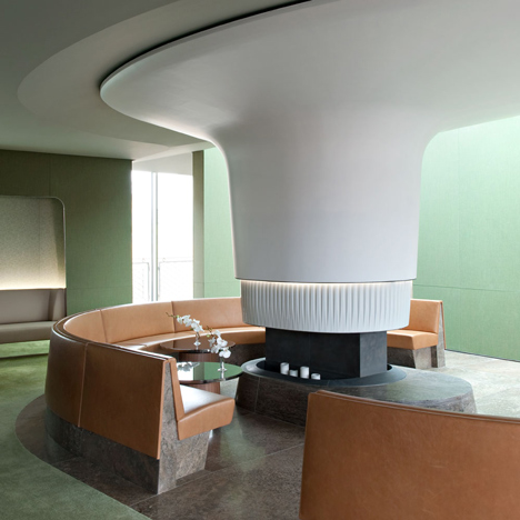 Nature-inspired hotel by Jouin Manku features an organic fireplace