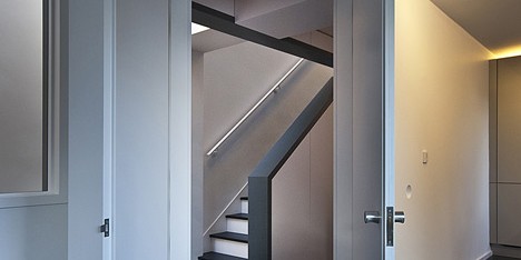 Long staircase spans converted London apartment by Patalab Architecture
