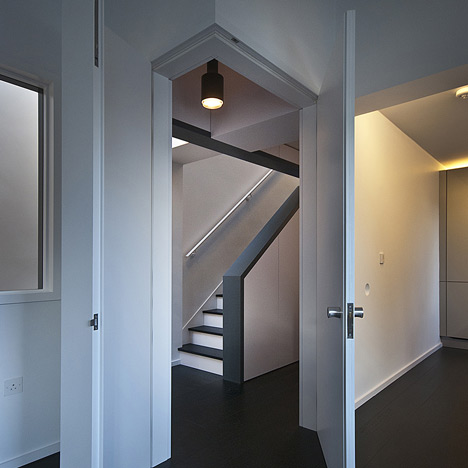 Long staircase spans converted London apartment by Patalab Architecture