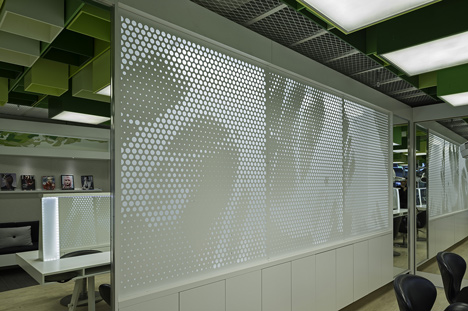 Green boxes cover the ceiling of Clip Drop In hair salon by Sweco Architects