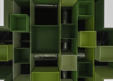 Green boxes cover the ceiling of Clip Drop In hair salon by Sweco Architects