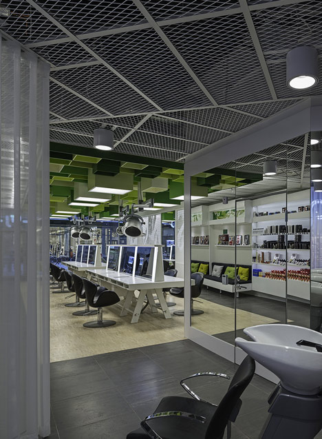 Green boxes cover the ceiling of Clip Drop In hair salon by Sweco Architects