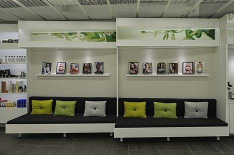 Green boxes cover the ceiling of Clip Drop In hair salon by Sweco Architects