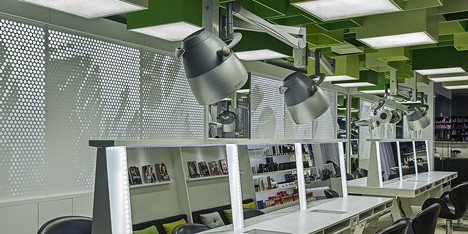 Green boxes cover the ceiling of Clip Drop In hair salon by Sweco Architects