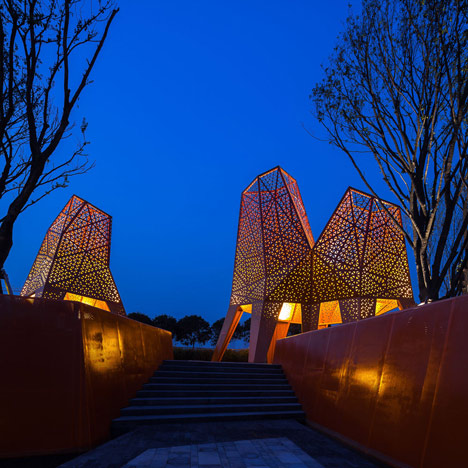 Four-legged perforated metal pavilions rise above Fengming Mountain Park