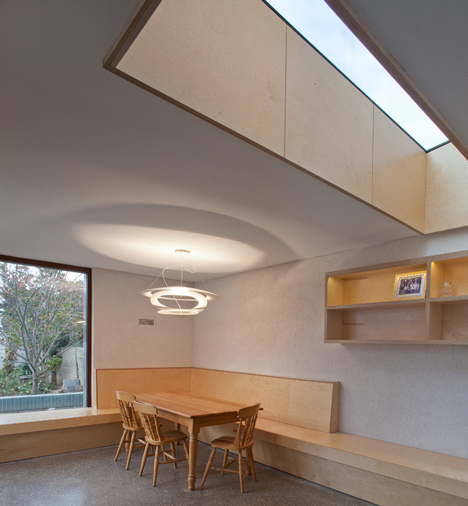 Tile-covered walls reflect light into Greenlea Road extension by GKMP Architects