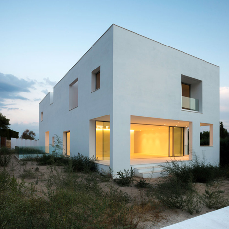 House H by Bojaus Arquitectura features a facade covered in holes