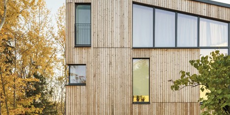 Timber-clad House M-M by Tuomas Siitonen wraps around a sheltered garden
