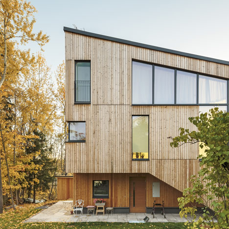Timber-clad House M-M by Tuomas Siitonen wraps around a sheltered garden