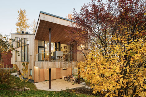 Timber-clad House M-M by Tuomas Siitonen wraps around a sheltered garden