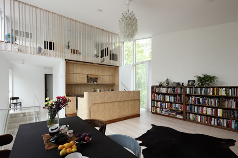 Timber-clad House M-M by Tuomas Siitonen wraps around a sheltered garden