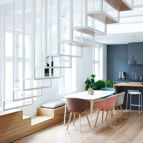 Floating steel staircase divides Haptic's Idunsgate Apartment in Oslo