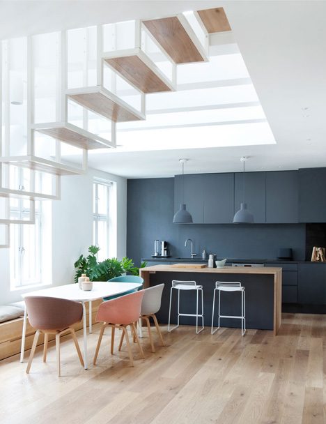 Floating steel staircase divides Haptic's Idunsgate Apartment in Oslo