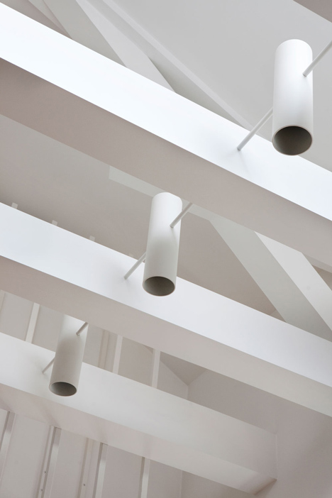 Floating steel staircase divides Haptic's Idunsgate Apartment in Oslo