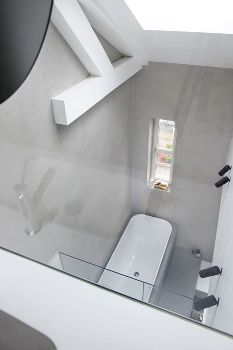 Floating steel staircase divides Haptic's Idunsgate Apartment in Oslo