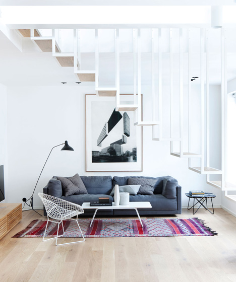 Floating steel staircase divides Haptic's Idunsgate Apartment in Oslo