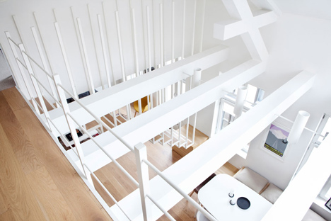 Floating steel staircase divides Haptic's Idunsgate Apartment in Oslo