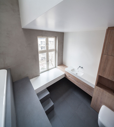 Floating steel staircase divides Haptic's Idunsgate Apartment in Oslo