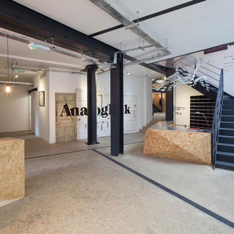 Industrial-style offices by DH Liberty mix reclaimed objects with minimal aesthetic