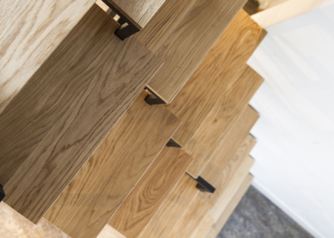 Suspended staircase combined with desk and storage space by Mieke Meijer
