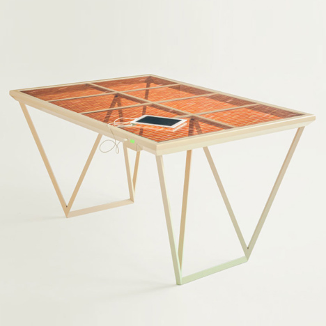 The Current Table by Marjan van Aubel features a solar panel for charging mobile phones