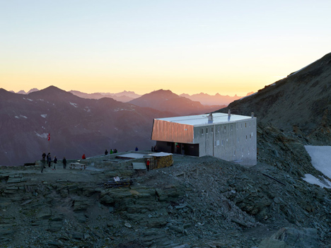 Steel-clad mountain hut by Savioz Fabrizzi Architectes wraps over an Alpine ridge