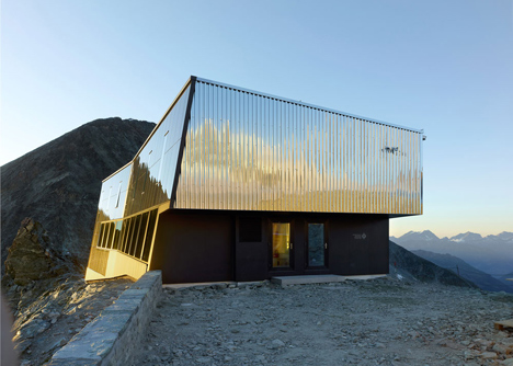 Steel-clad mountain hut by Savioz Fabrizzi Architectes wraps over an Alpine ridge