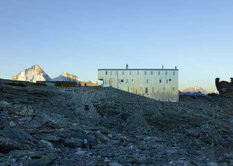 Steel-clad mountain hut by Savioz Fabrizzi Architectes wraps over an Alpine ridge