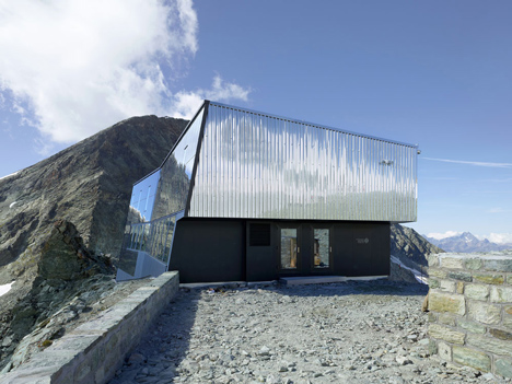 Steel-clad mountain hut by Savioz Fabrizzi Architectes wraps over an Alpine ridge