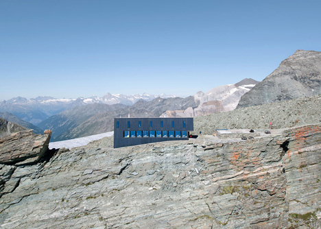 Steel-clad mountain hut by Savioz Fabrizzi Architectes wraps over an Alpine ridge