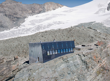 Steel-clad mountain hut by Savioz Fabrizzi Architectes wraps over an Alpine ridge
