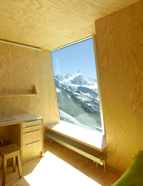 Steel-clad mountain hut by Savioz Fabrizzi Architectes wraps over an Alpine ridge