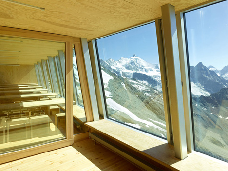Steel-clad mountain hut by Savioz Fabrizzi Architectes wraps over an Alpine ridge