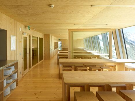 Steel-clad mountain hut by Savioz Fabrizzi Architectes wraps over an Alpine ridge
