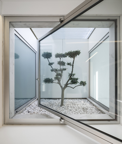 Parede 11 house by Humberto Conde has hinged protective panels