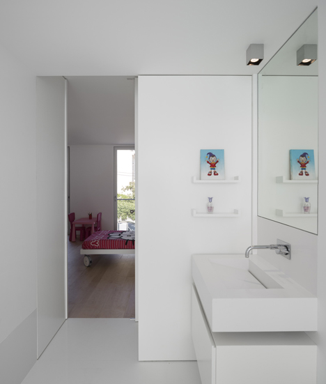 Parede 11 house by Humberto Conde has hinged protective panels