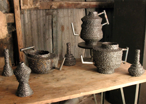 Josh Bitelli uses welding equipment to make containers from coils of molten steel