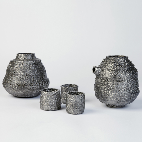 Josh Bitelli uses welding equipment to make containers from coils of molten steel