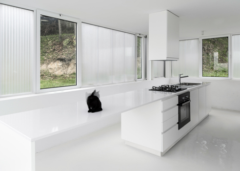 White buildings sink into the landscape at the White Wolf Hotel by AND-RÉ