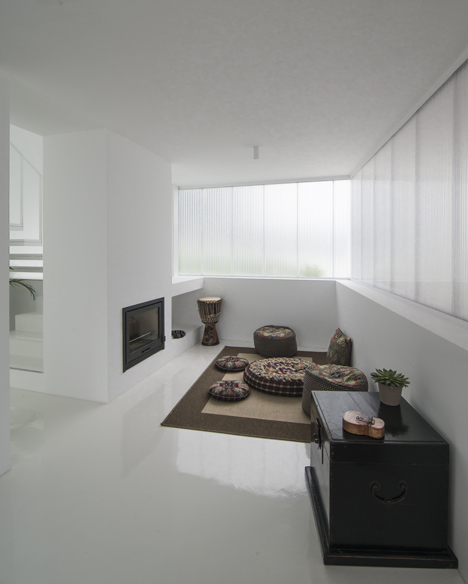 White buildings sink into the landscape at the White Wolf Hotel by AND-RÉ