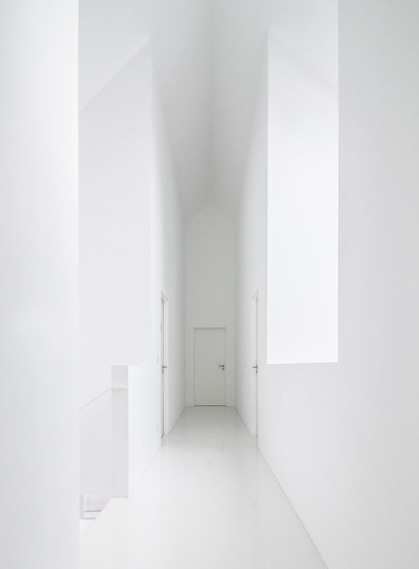 White buildings sink into the landscape at the White Wolf Hotel by AND-RÉ