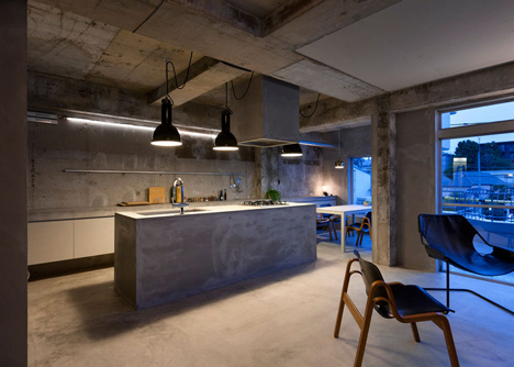 Bare concrete apartment by Airhouse Design Office presents its own fashion exhibitions