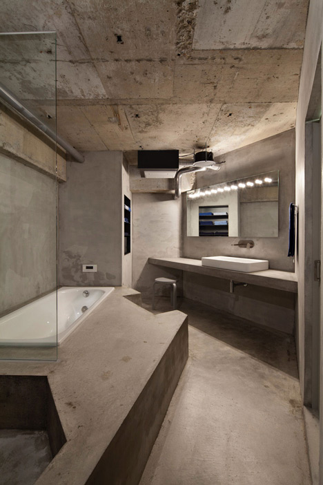 Bare concrete apartment by Airhouse Design Office presents its own fashion exhibitions