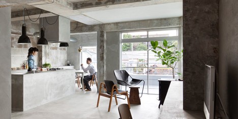 Bare concrete apartment by Airhouse Design Office presents its own fashion exhibitions