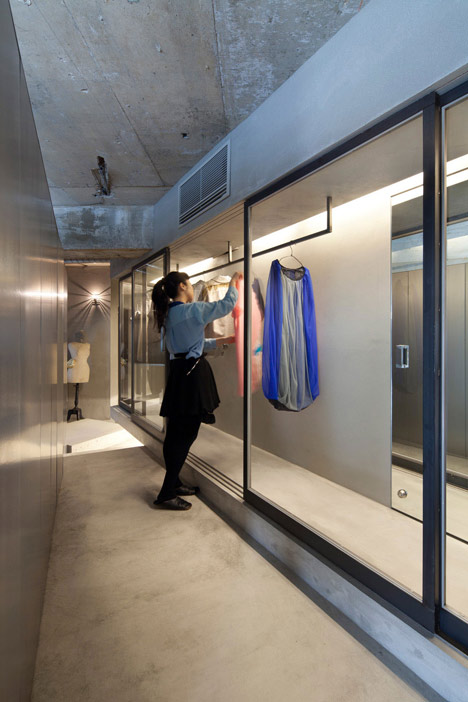 Bare concrete apartment by Airhouse Design Office presents its own fashion exhibitions