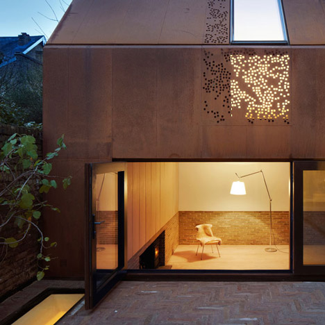 Weathered steel sits alongside ageing brickwork at Kew House by Piercy & Company